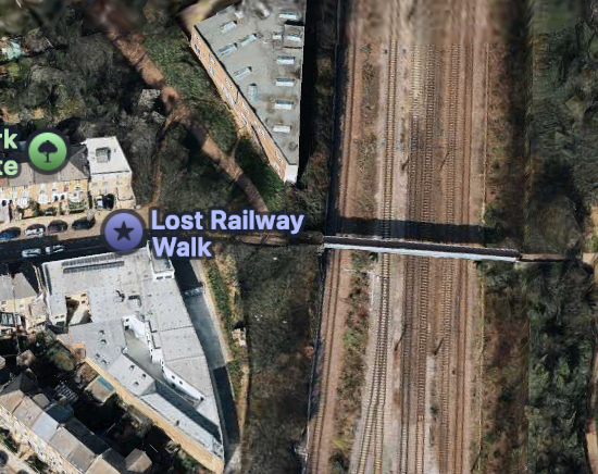 A screenshot from Apple Maps showing an aerial view of an area in north London with a label “Lost Railway Walk” just meters away from a railway.