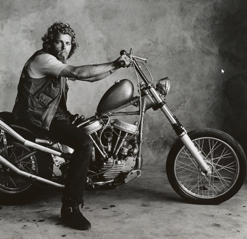 A gripping b/w photo of a hells Angel, Doug, on his low rider (fixed frame?) bike, San Fransisco, 1967.

Irving Penn, Hell's Angel (Doug), San Francisco, 1967, printed before 1975. Gelatin silver print, 18 13/16 x 19 11/16 in. (47.8 x 50 cm.). The Metropolitan Museum of Art, Gift of The Irving Penn Foundation, 2021 © The Irving Penn Foundation