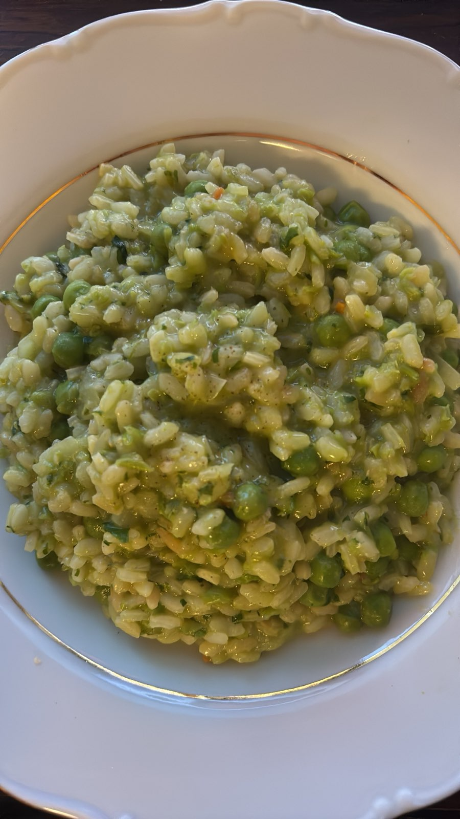 green pea risotto on a white plate