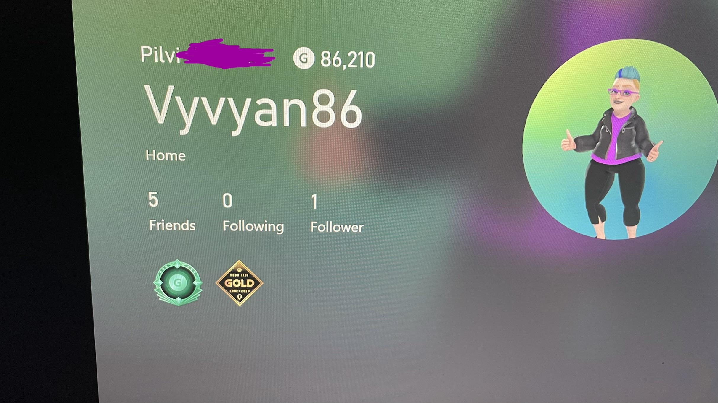 The front page of my Xbox profile on Xbox. I have covered my last name, otherwise you can see my first name, my gamer score, my username and how many friends I have on Xbox. At the bottom there are two badges, a green G and a diamond shaped one that says Gold and some other things I can’t make out at all. On the right is my avatar which I haven’t updated in a number of years.